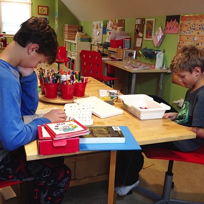 boys at the table homeschooling