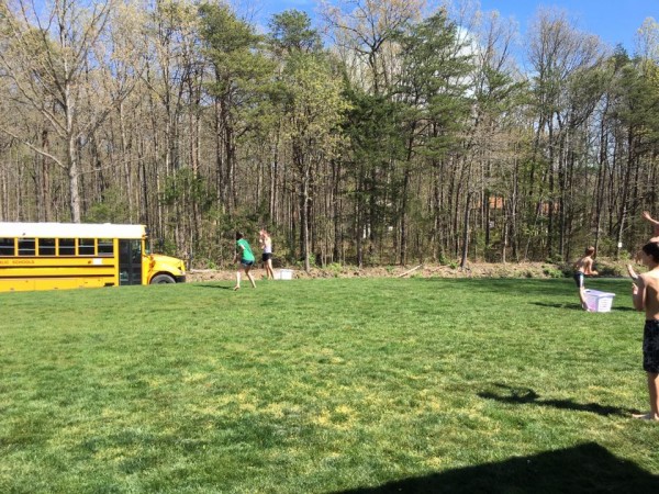 water ballon with school bus driving by