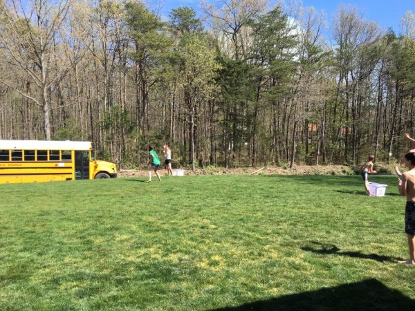 water ballon with school bus driving by